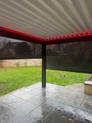 Pergolas design, pose murale ou libre : pergola bioclimatique alu izi marquises led rouge yvelines. Wilco Yvelines 78